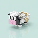 Toy figure made of Sheep Building Block on a light blue background