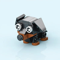 Toy figure made of interlocking bricks on a light blue background