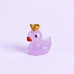 Miniature Glow Crown Duck Assorted (1pc) displayed on a light purple background.