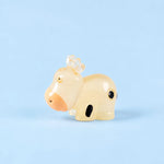 Miniature Glow Cow Assorted (1pc) displayed on a light blue background