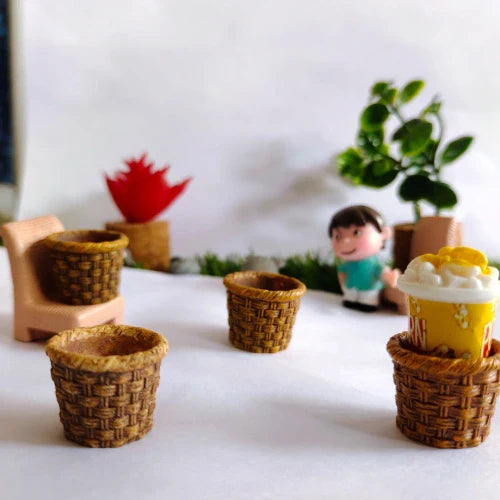 This is an image of three brown color Miniature Baskets with flowers in the background.