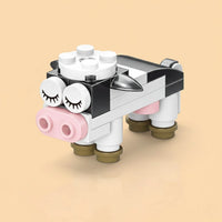 Cow Building Block (1Pc) made of interlocking bricks on a beige background
