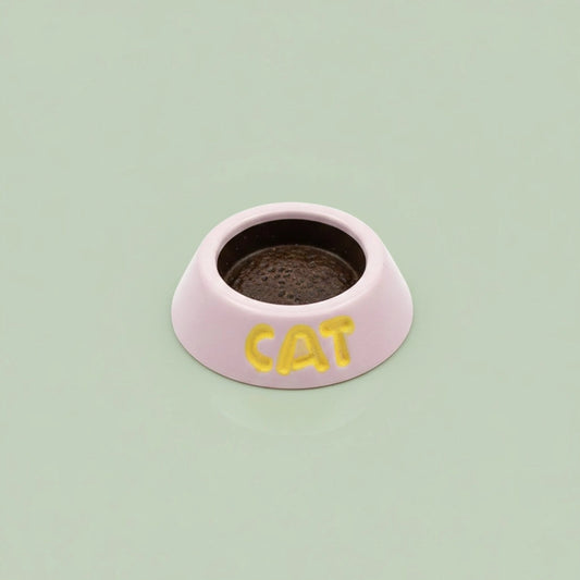 Miniature Cat Feeder (1pc) on the green background.