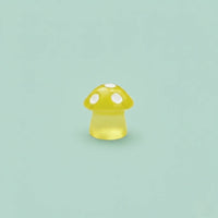 Yellow mushroom-shaped object on a light blue background