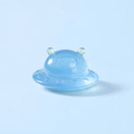 Miniature Glow Alien Saucer Assorted (1pc) displayed on a light blue background