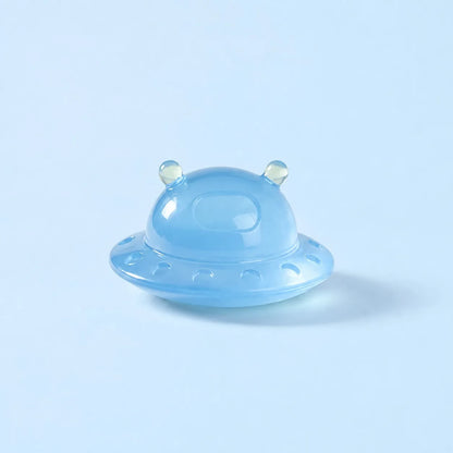 Miniature Glow Alien Saucer Assorted (1pc) displayed on a light blue background