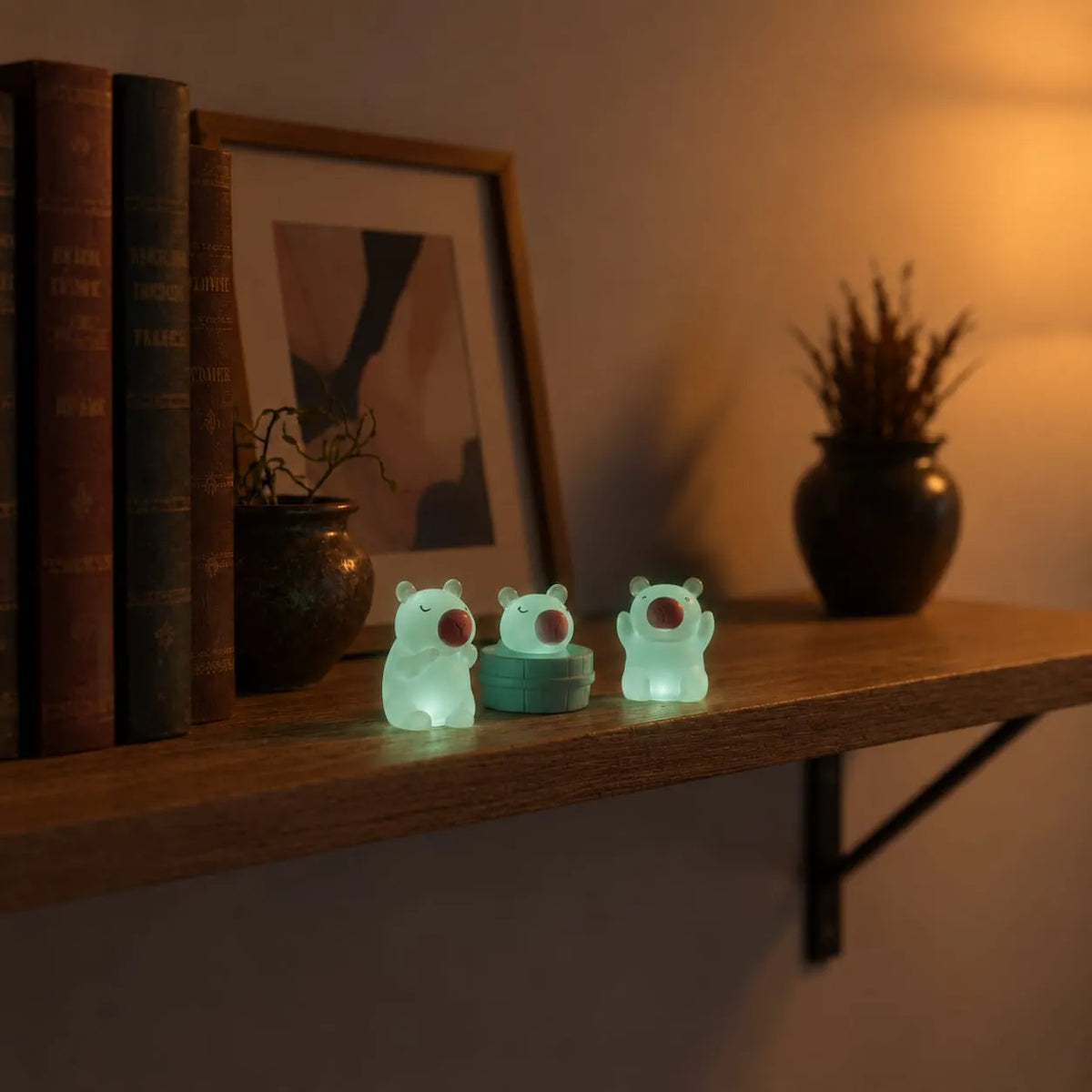 Miniature Glow Cute Pig Assorted (1pc) glowing on a wooden shelf in a dimly lit room