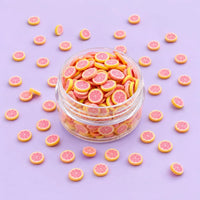 Miniature Polymer Clay Pink Orange (10pcs) displayed on a light purple background