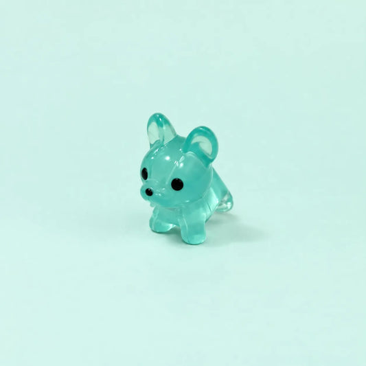 Miniature Glow Mini Dogs Assorted (1pc) displayed on a mint green background