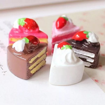 A cute different Miniature Dollhouse Pastry kept on white table.