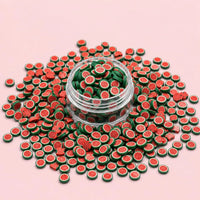 Miniature Polymer Clay Full Watermelon Slice (10pcs) displayed on a pink background