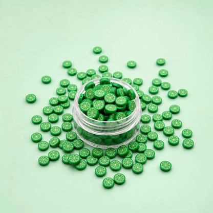 Miniature Polymer Clay Green Orange (10pcs) displayed on a mint green background