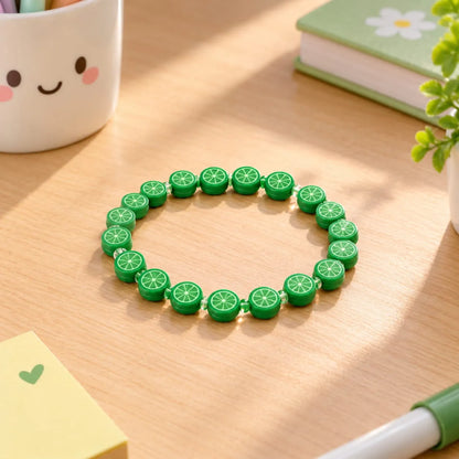 Miniature Polymer Clay Green Orange (10pcs) used to create a colorful bracelet