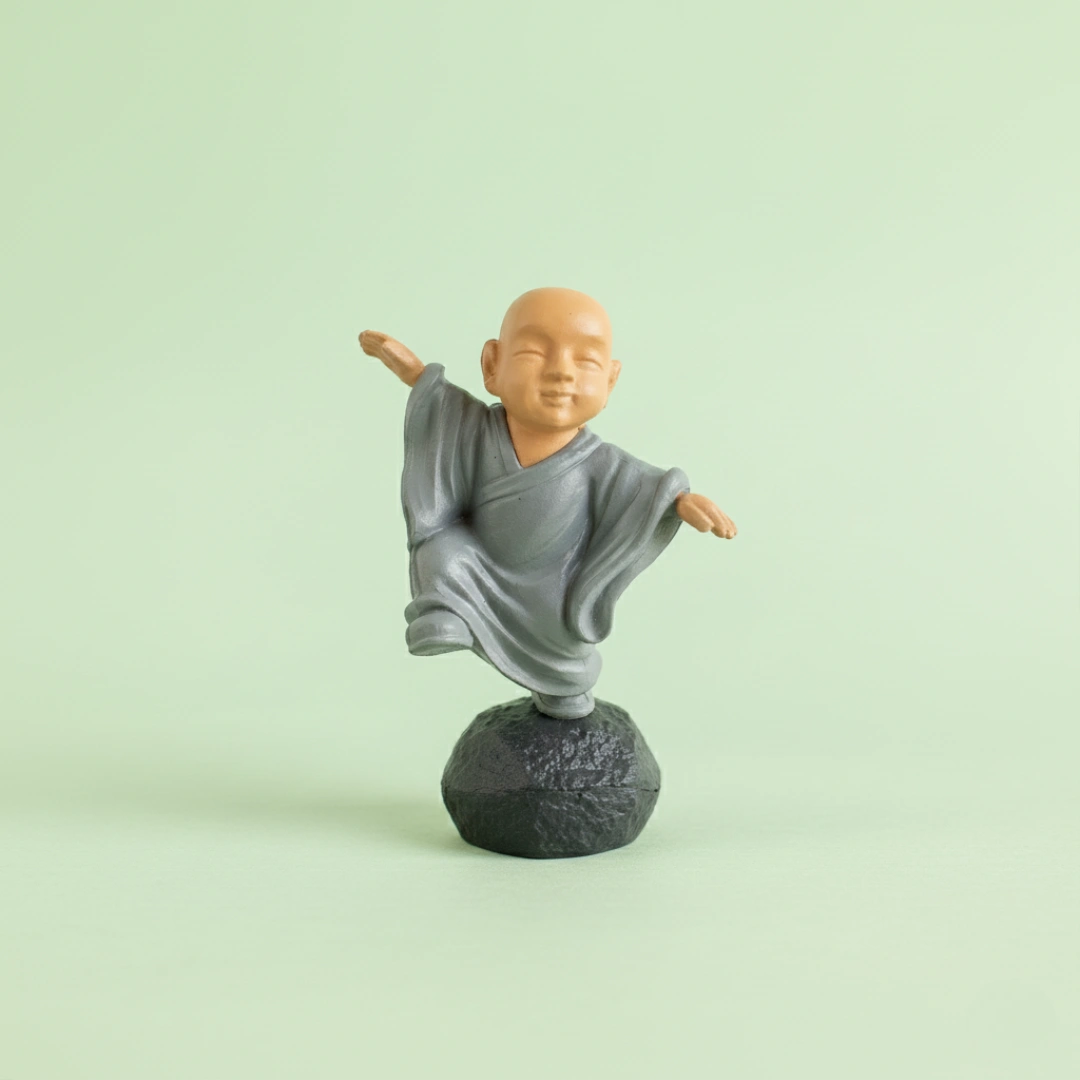 Miniature Chinese Feng Shui Monks (1pc) on the light background.