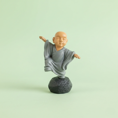 Miniature Chinese Feng Shui Monks (1pc) on the light background.