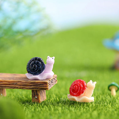 Miniature Snails for Fairy Gardens figures in a garden theme.