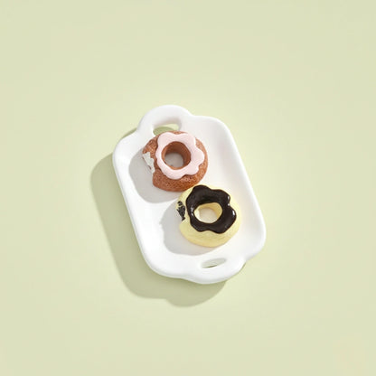 Miniature Dollhouse Doughnuts on the white background.