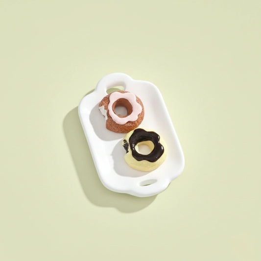 Miniature Dollhouse Doughnuts on the white background.