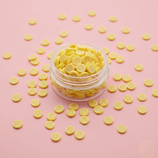 Miniature Polymer Clay Lemon (10pcs) on the pink background.