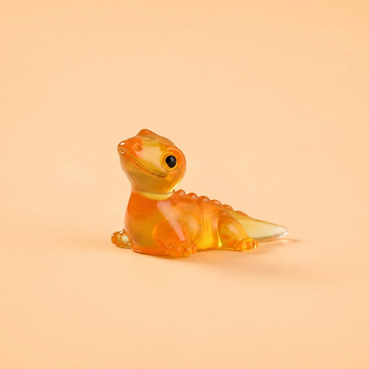 Miniature Glow Lizard Assorted (1pc) displayed on a peach background