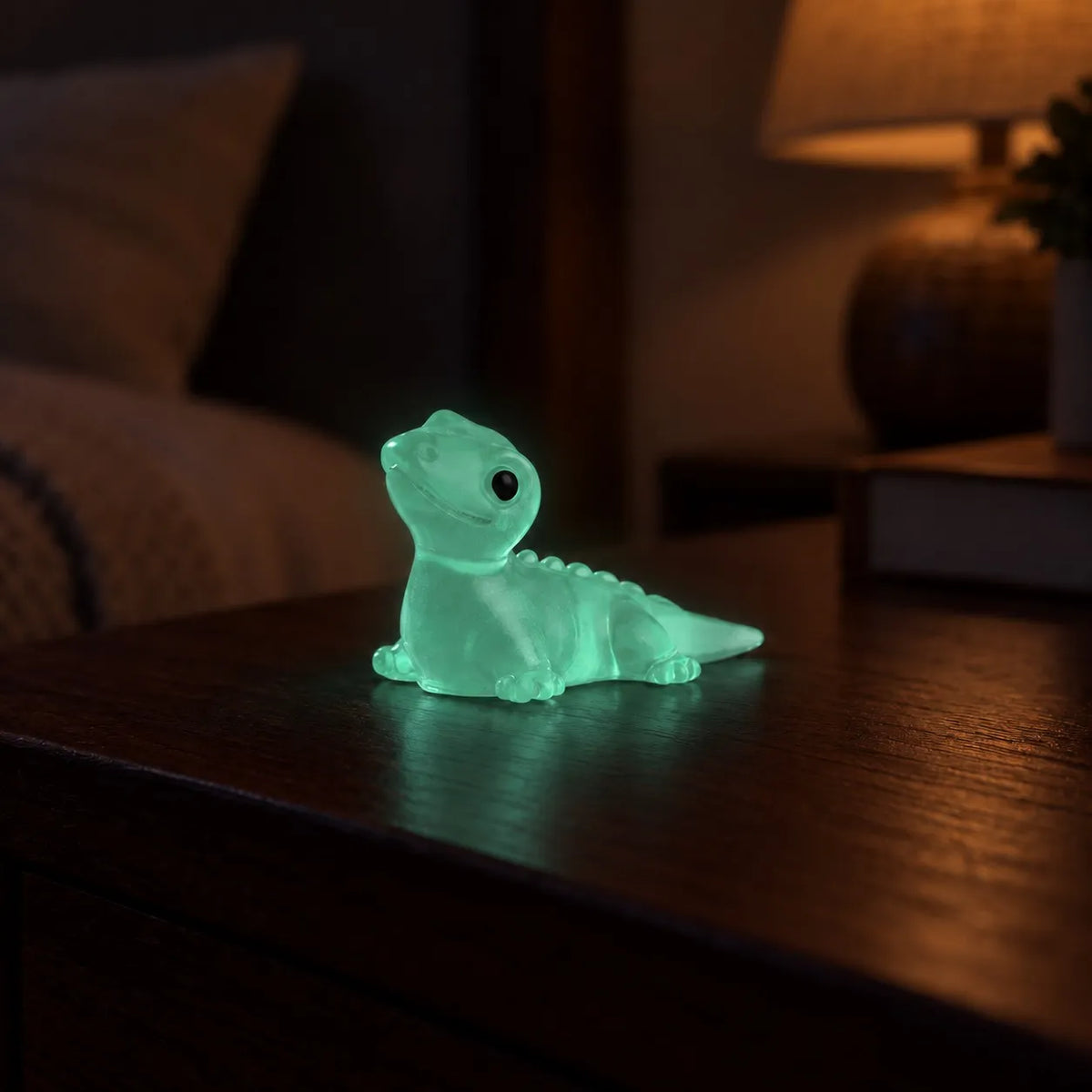 Miniature Glow Lizard Assorted (1pc) glowing on a dark table
