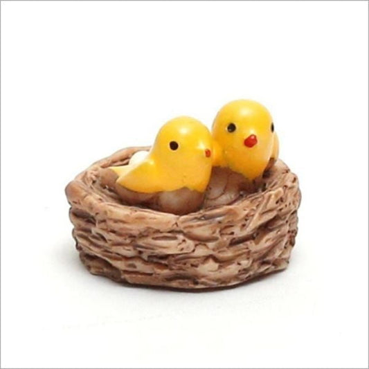 A cute Miniature Bird Nest on a white surface.