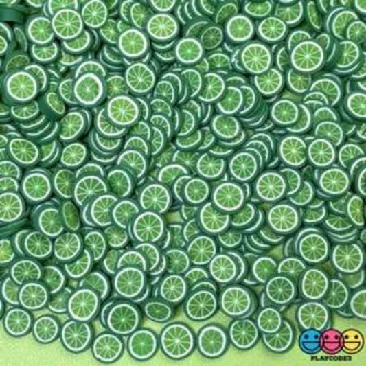 Several Miniature Polymer Clay Green Oranges on a floor.