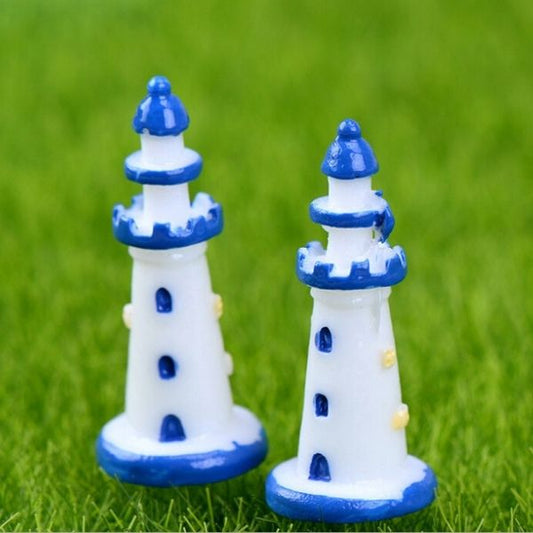 A beautiful Miniature Sea Side Watch Light Tower on a grass.
