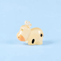 Miniature Glow Cow Assorted (1pc) displayed on a light blue background