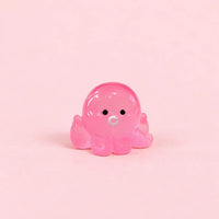 Miniature Glow Octopus Assorted (1pc) on a light pink background