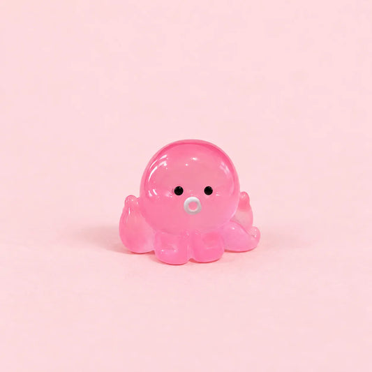Miniature Glow Octopus Assorted (1pc) on a light pink background