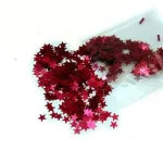Red Sparkling Stars on a white sheet of paper.
