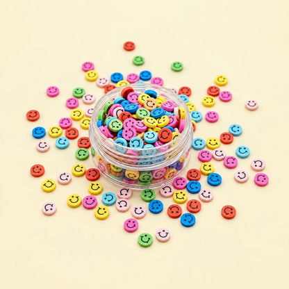 Miniature Polymer Clay Smiley Assorted (10pcs) displayed on a light pink background