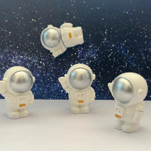 This is an image of the Miniature Astronaut with a starry night background