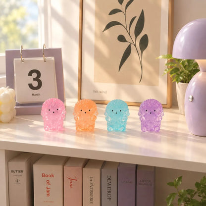 Miniature Glow Teddy Dog Assorted (1pc) displayed on a shelf with other glowing miniatures
