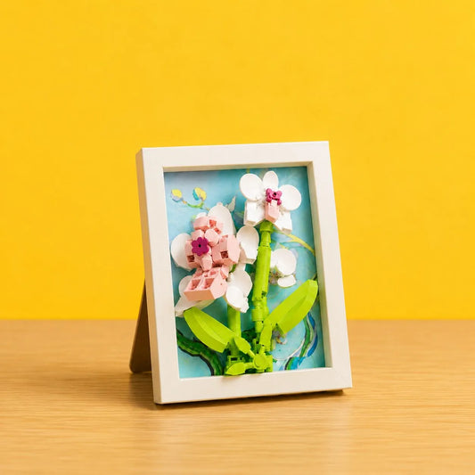 Pink Orchid Flower Frame Building Block (1Pc) displayed on a wooden table