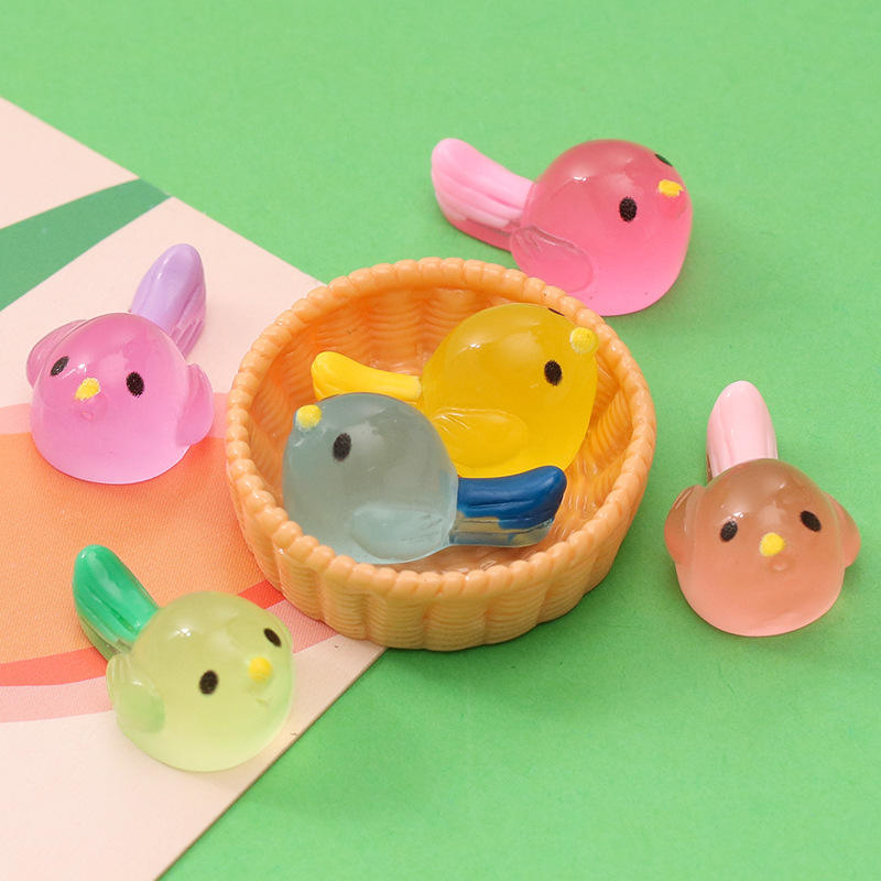 Collection of Miniature Bird Sparrow Toy Gift on the green background.