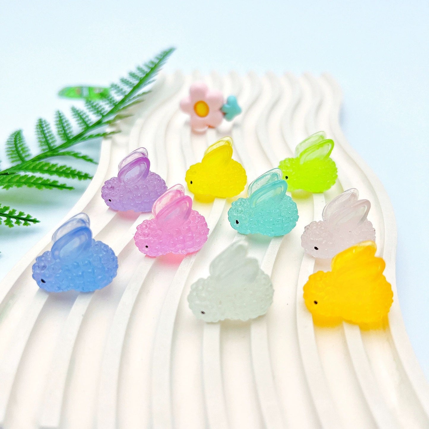 Collection of Miniature Glow Resin Rabbits in different colours.