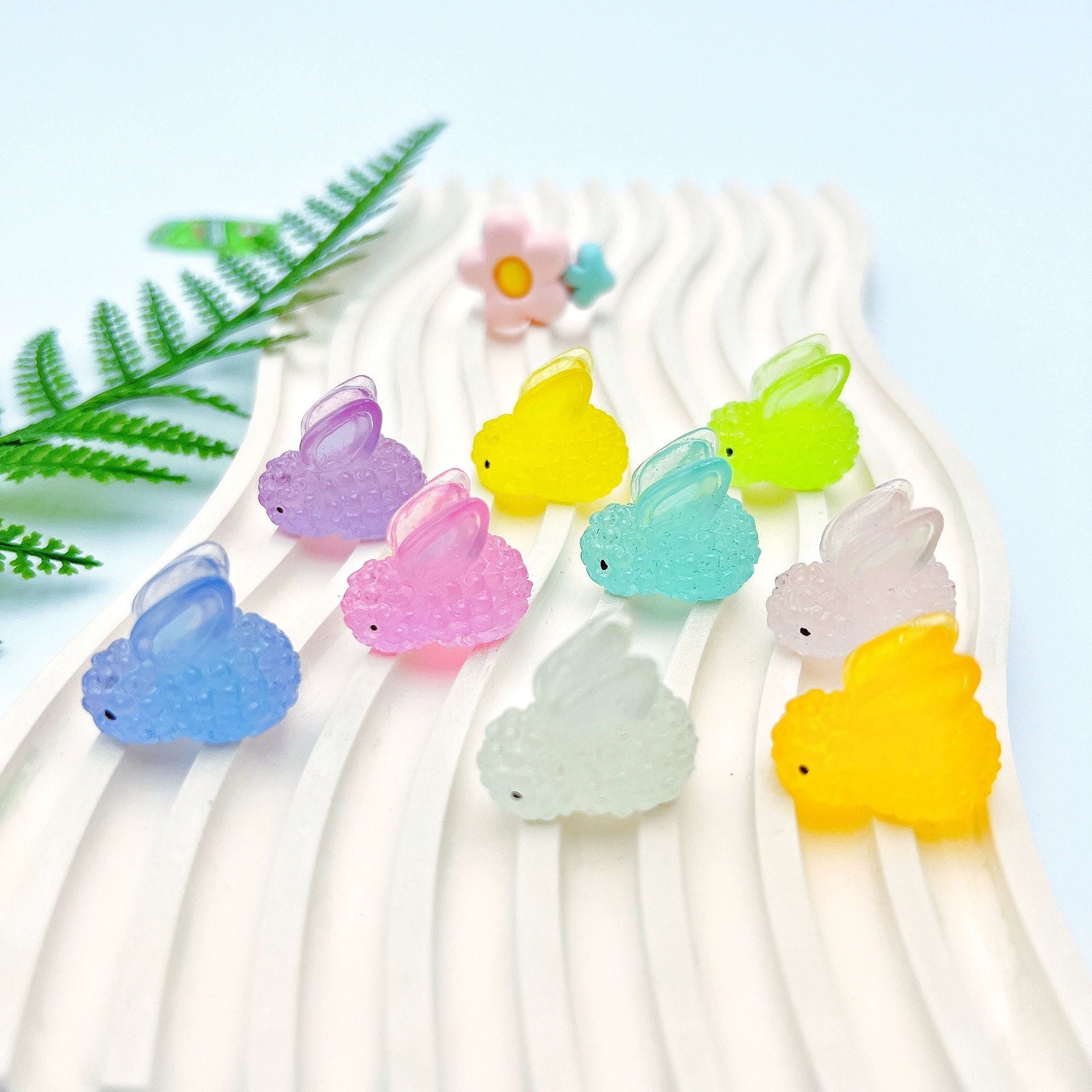 Collection of Miniature Glow Resin Rabbits in different colours.